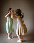 Natural growth supporting baby dress with plant dyes