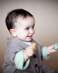 ALMOND jacket in Acorn Brown / Sage — child wearing the jacket