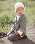 ALMOND jacket in Rosemary / Cinnamon — worn by a child