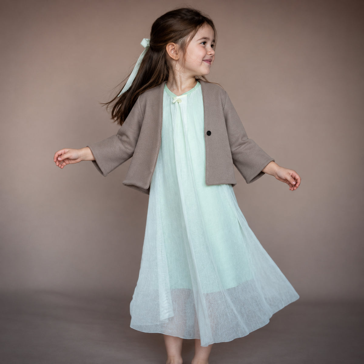 TRIFOLIUM jacket in Acorn Brown — worn by a child